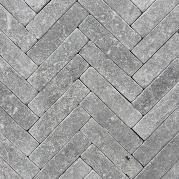 Meli Dark Grey tumbled limestone slimsetts laid in herringbone pattern