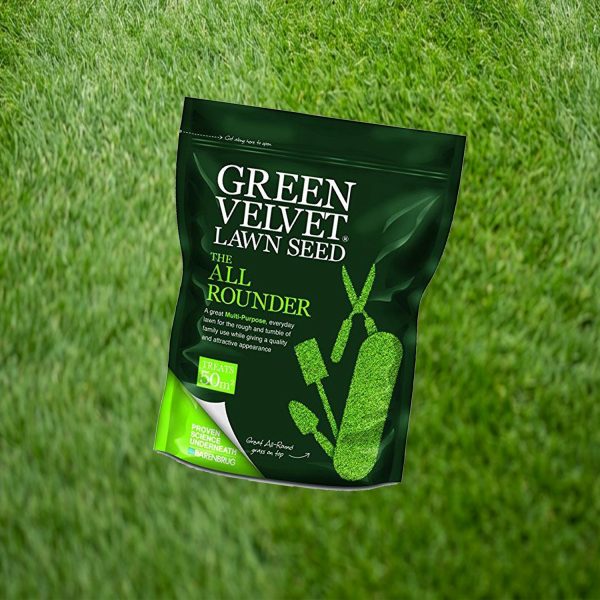 Green Velvet Lawn Seed 50m² pack lying on a freshly mown lawn