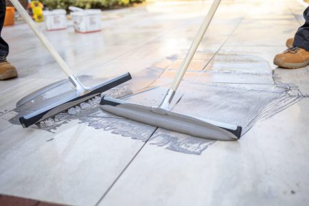 Measuring and marking porcelain paving slabs on site during installation planning